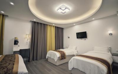 Chambre Quadruple avec 1u00a0Lit Double et 2u00a0Lits Simples