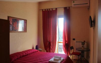 Camera Familiare con Vista Giardino