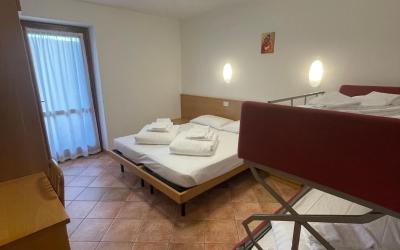 Camera Quadrupla Superior