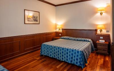 Camera Quadrupla Superior