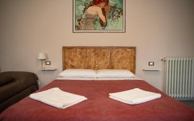 Camera Quadrupla con Vista Giardino 