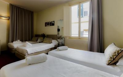 Camera Quadrupla Superior