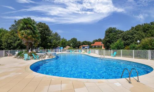 Gîte in a holiday park with swimming pool