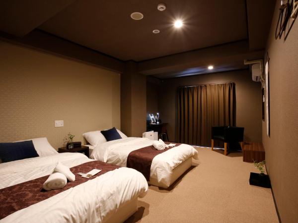 Sumiya Spa & Hotel : photo 1 de la chambre chambre lits jumeaux supérieure avec salle de bains commune