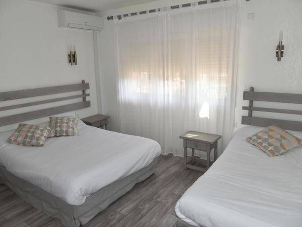 Hôtel Les Mimosas : photo 2 de la chambre chambre triple standard climatisée