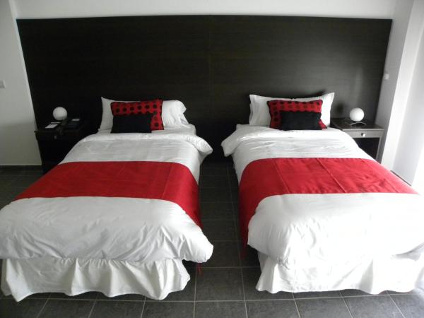 Let Sun Hotel Boutique : photo 9 de la chambre chambre lits jumeaux