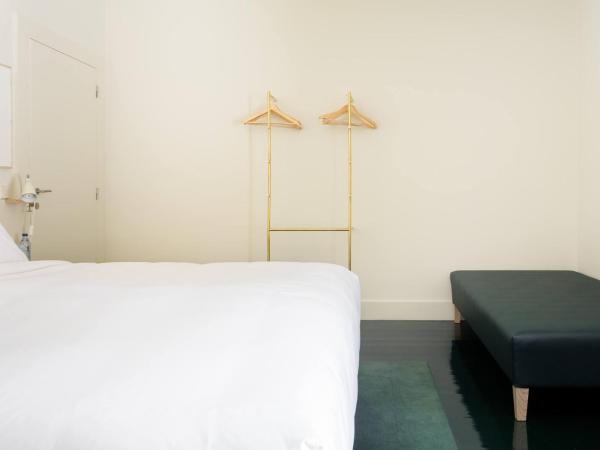 Duas Portas Townhouse : photo 2 de la chambre chambre triple - vue sur jardin