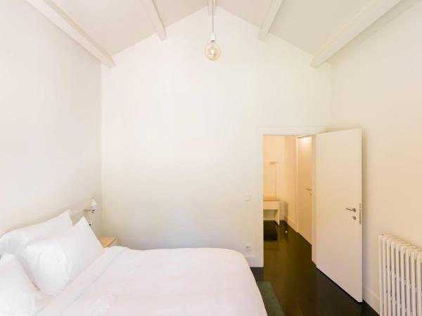 Duas Portas Townhouse : photo 2 de la chambre chambre double deluxe - vue sur jardin
