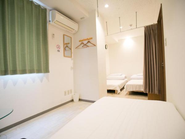 123 Guesthouse : photo 2 de la chambre triple room with shared bathroom - a