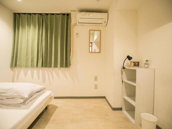 123 Guesthouse : photo 1 de la chambre single room with shared bathroom - d