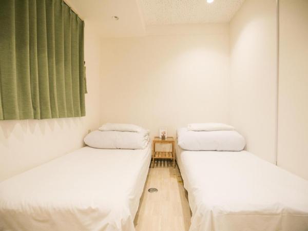 123 Guesthouse : photo 2 de la chambre twin room with shared bathroom - e