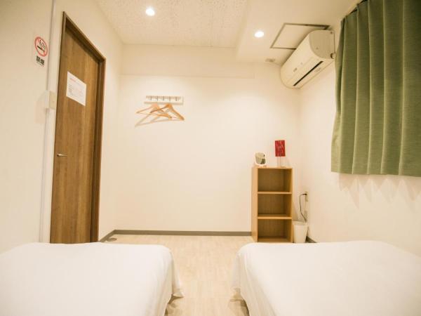 123 Guesthouse : photo 4 de la chambre twin room with shared bathroom - e