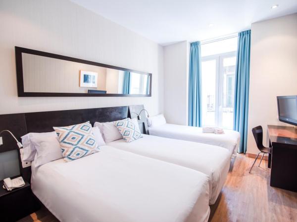Petit Palace Plaza de la Reina : photo 2 de la chambre chambre triple