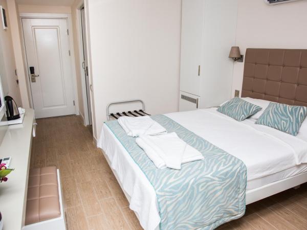 Asli Hotel : photo 10 de la chambre chambre double ou lits jumeaux - vue sur piscine
