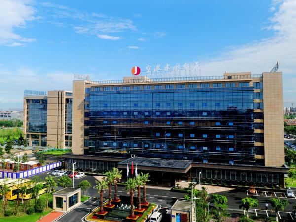 Airport Jianguo Hotel : photo 3 de la chambre chambre lits jumeaux Économique