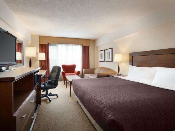 Travelodge Hotel by Wyndham Saskatoon : photo 1 de la chambre chambre lit king-size affaires - non-fumeurs