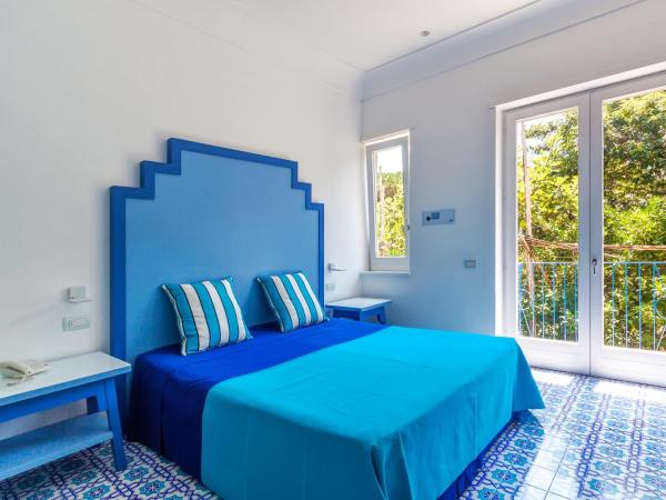 Hotel Mignon Meublè : photo 4 de la chambre chambre lit king-size deluxe