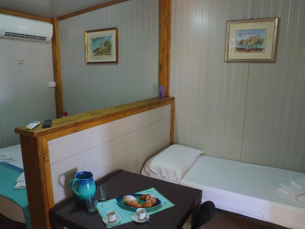 Camping Jonio : photo 1 de la chambre bungalow (2 adultes + 1 enfant)