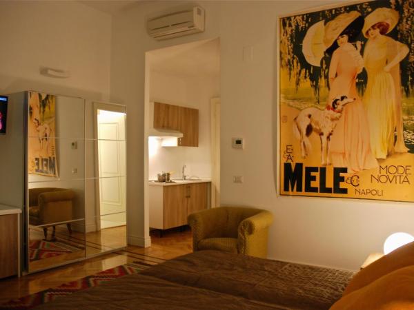 Palazzo Mele Residence : photo 7 de la chambre chambre double ou lits jumeaux supérieure - vue sur jardin