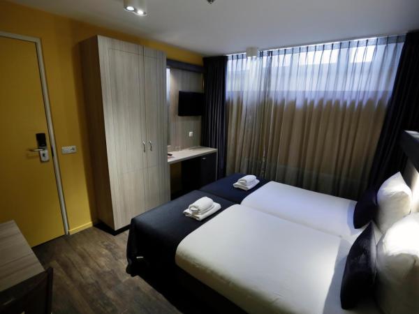 City Hotel Amsterdam : photo 5 de la chambre chambre lits jumeaux en sous-sol
