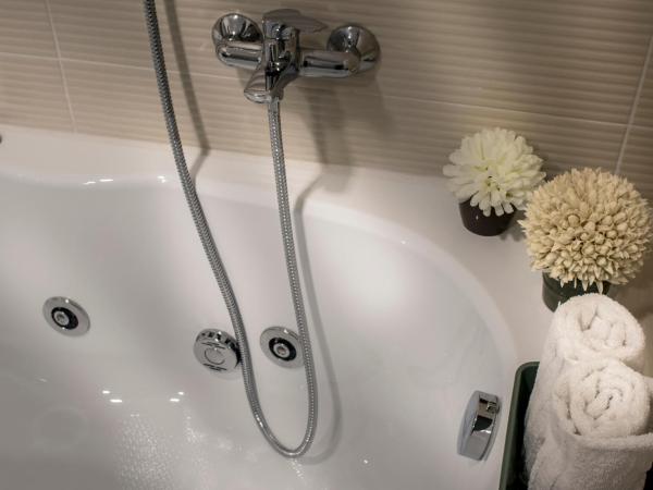 Ad Hoc Rooms : photo 8 de la chambre chambre quadruple avec balcon