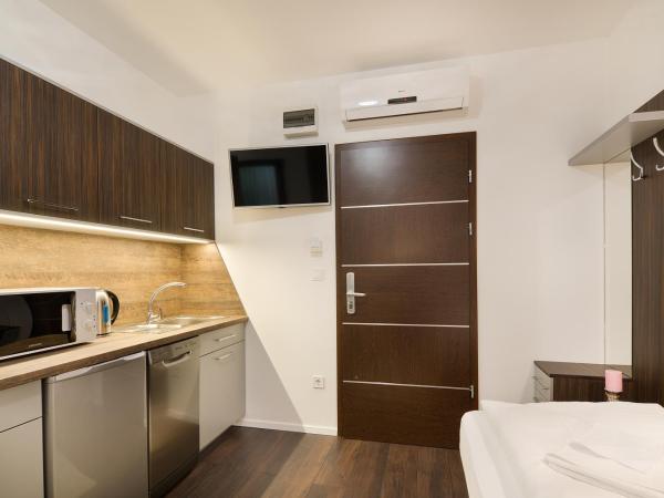 Paulay Downtown Apartments : photo 1 de la chambre chambre lits jumeaux standard