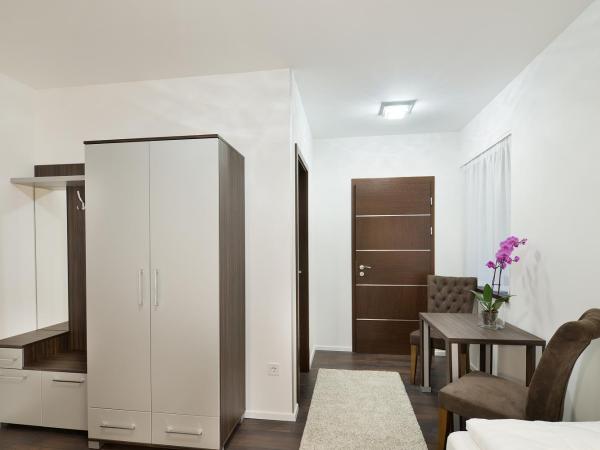 Paulay Downtown Apartments : photo 4 de la chambre chambre familiale standard