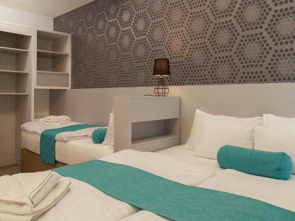 Hotel Mika Downtown : photo 3 de la chambre chambre triple deluxe