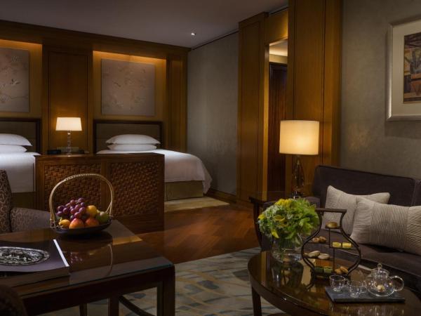 Four Seasons Hotel Hangzhou at West Lake : photo 2 de la chambre chambre lits jumeaux premier - vue sur jardin