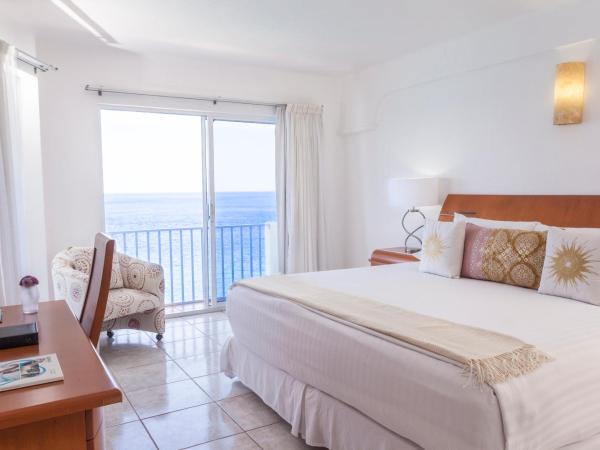 Coral Princess Hotel & Dive Resort : photo 6 de la chambre hébergement lit king-size de luxe – côté océan