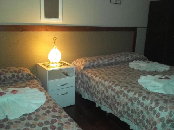 Posada La Casona : photo 2 de la chambre chambre triple avec salle de bains commune