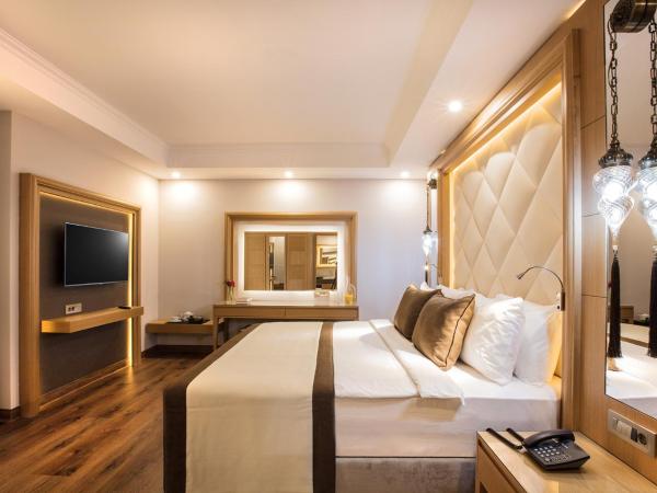 Korumar Ephesus Beach & Spa Resort - Ultra All Inclusive : photo 1 de la chambre suite - vue sur jardin