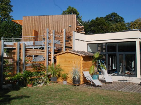 La Gourmandine : photo 2 de la chambre chambre lit queen-size avec baignoire spa