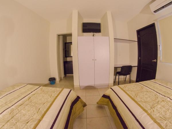 Hotel Belisario INN : photo 2 de la chambre chambre double avec 2 lits doubles