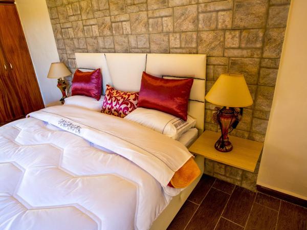 Maison d'hôtes La Ferme AZIZA : photo 2 de la chambre chambre double deluxe (2 adultes + 1 enfant)