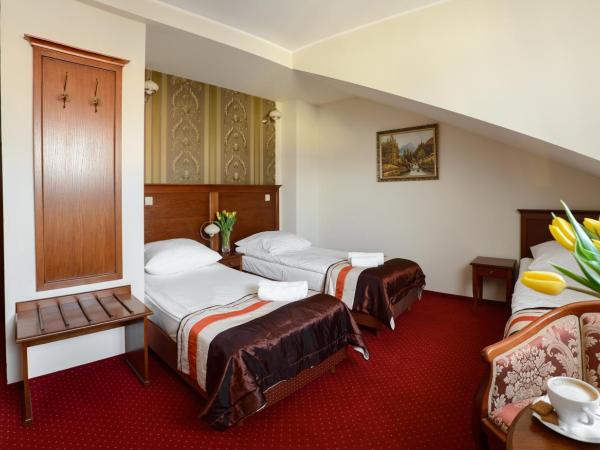 Dworek Vesaria : photo 2 de la chambre chambre triple