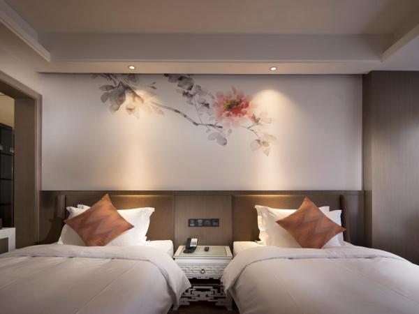 Paco Hotel Dongpu Guanghzou -Free Shuttle Bus for Canton Fair : photo 6 de la chambre chambre lits jumeaux deluxe