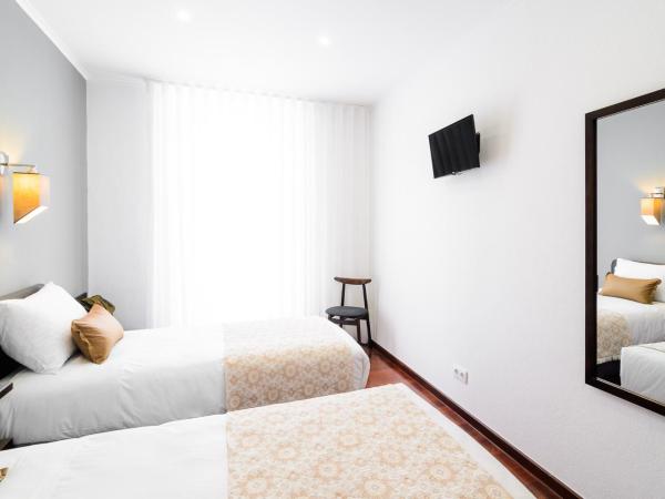 Hotel Portuense Lisboa : photo 4 de la chambre chambre lits jumeaux