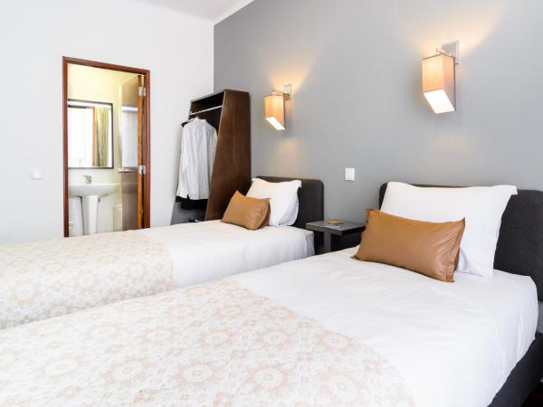 Hotel Portuense Lisboa : photo 1 de la chambre chambre lits jumeaux
