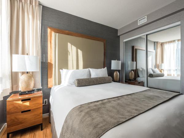 Carmana Hotel & Suites : photo 4 de la chambre suite 2 chambres exécutive avec 1 lit king-size et 1 lit queen-size