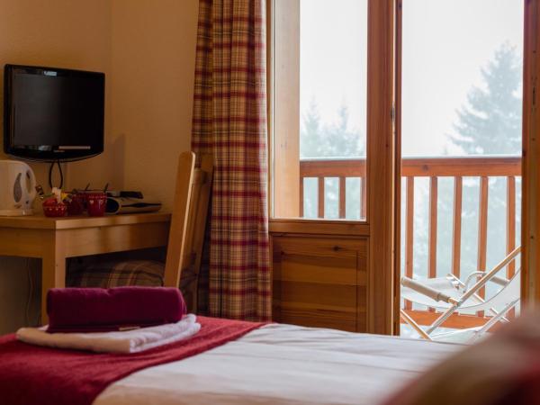 Chalet Coeur des Brévières by Chalet Chardons : photo 5 de la chambre chambre double ou lits jumeaux avec balcon