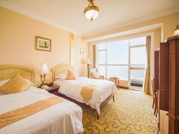 Huiquan Dynasty Hotel Qingdao : photo 3 de la chambre chambre lits jumeaux exécutive avec vue sur la mer
