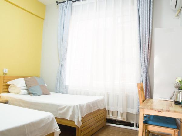 大连天天青旅民宿 : photo 4 de la chambre chambre lits jumeaux avec toilettes communes