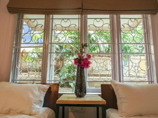 Locul Uptown - Near Bangalore Palace Grounds : photo 3 de la chambre chambre lits jumeaux deluxe