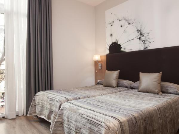 Hostal Centric : photo 2 de la chambre chambre quadruple