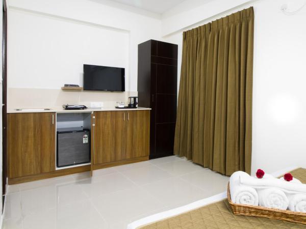 Sanctum Suites Whitefield Bangalore : photo 8 de la chambre chambre supérieure lit queen-size