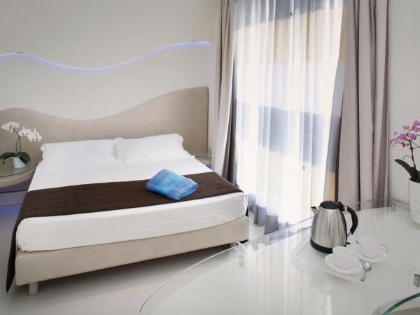 Bellariva Feeling Hotel : photo 1 de la chambre chambre quadruple supérieure avec balcon