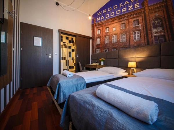 Boogie ApartHouse Old Town : photo 1 de la chambre chambre double ou lits jumeaux avec salle de bains privative