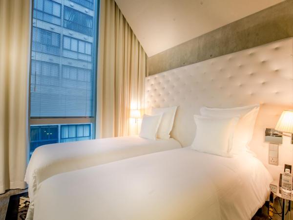 M Social Singapore : photo 6 de la chambre hébergement alcôve lits jumeaux confortable