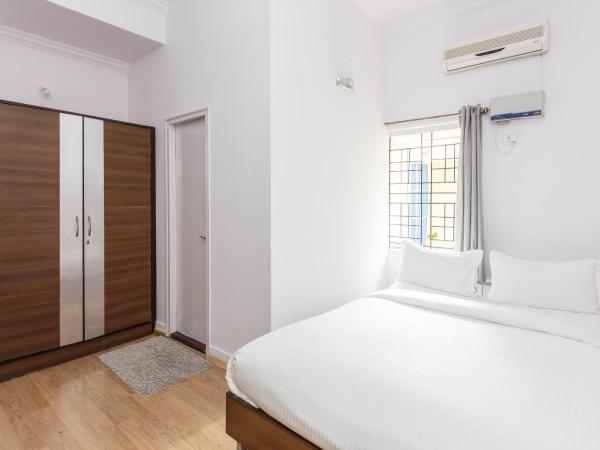 Locul Uptown - Near Bangalore Palace Grounds : photo 2 de la chambre chambre simple deluxe